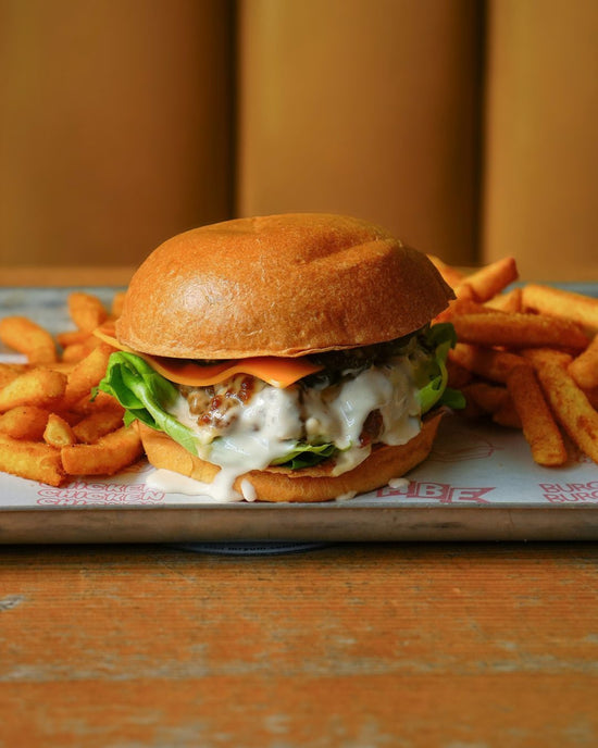 The Pickler fried chicken burger with pickle ranch, pickles, lettuce and cheese, His Boy Elroy October 2026 special