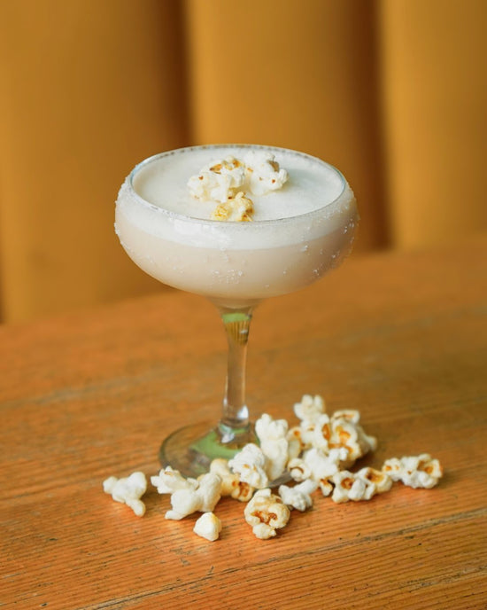 Popcorn Palooza cocktail garnished with popcorn, His Boy Elroy October 2026 special